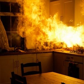 Fire raging in domestic kitchen at night