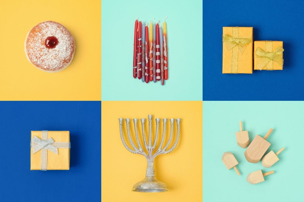 Jewish holiday Hanukkah design with menorah, gift boxes, dreidel. View from above.