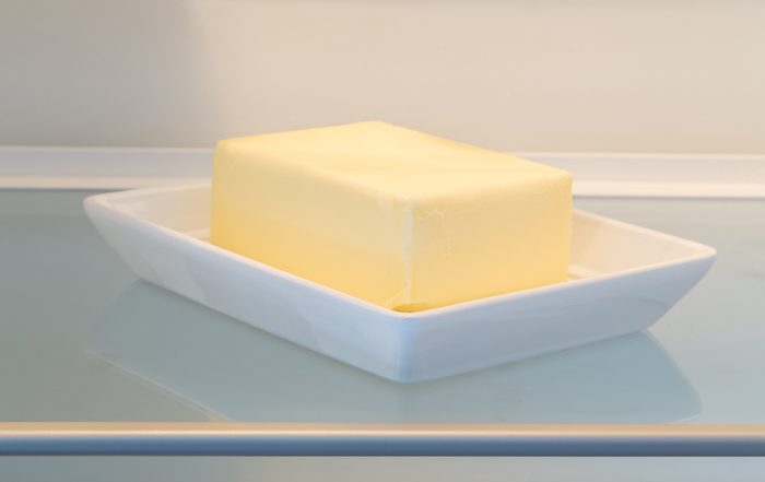 Butter in opened refrigerator concept
