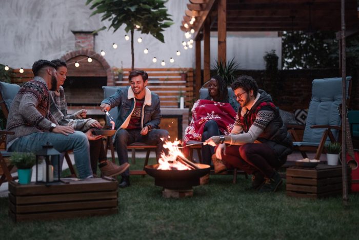Group of Friends Gathered Around a Fire Pit