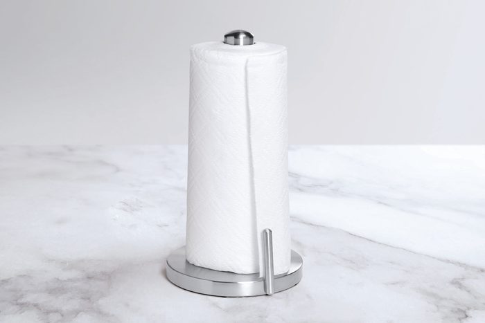 Paper towel holder on a white marble countertop