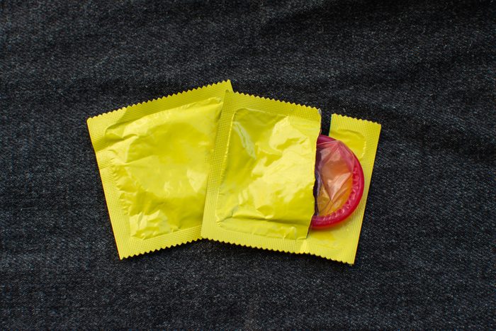 Directly Above Shot Of Condom On Jeans