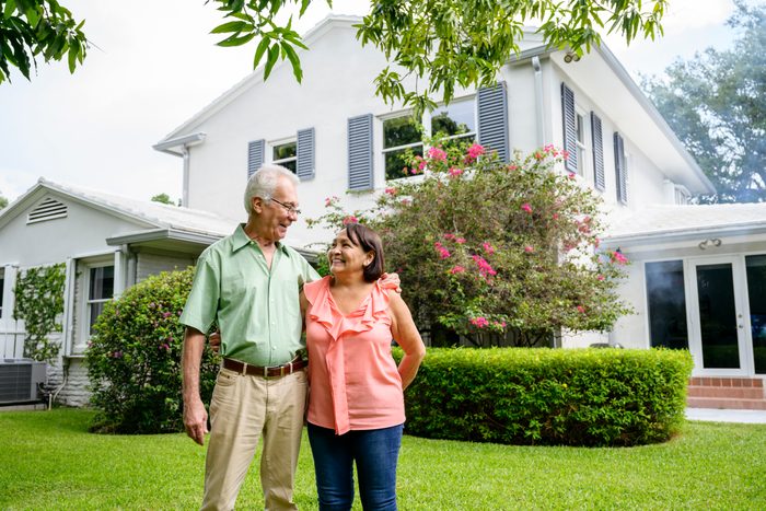 Embracing Latin American seniors in backyard of Miami home