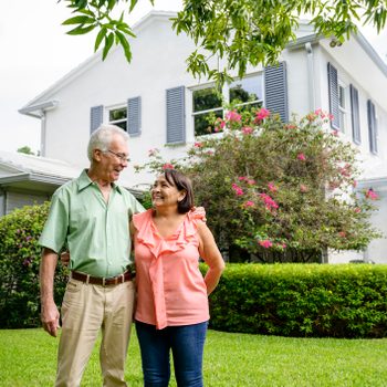 Embracing Latin American seniors in backyard of Miami home