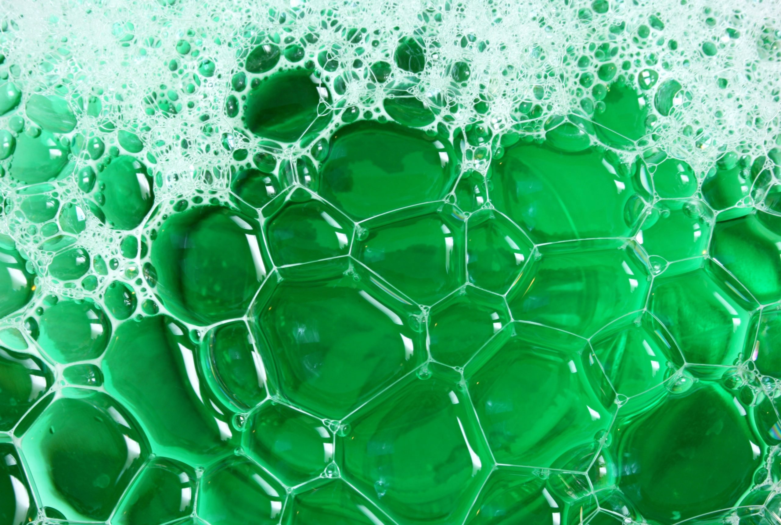 Group of green bubbles on white background