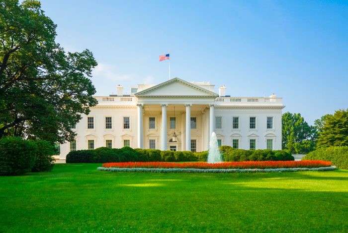 The White House, green lawn, blue sky, early morning light