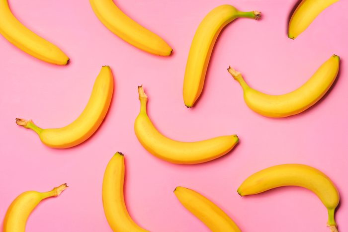 Fruit pattern of bananas over a pink background