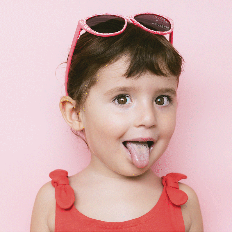 Child with colors dancing off tongue