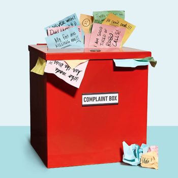 red complaint box overflowing with colorful note papers