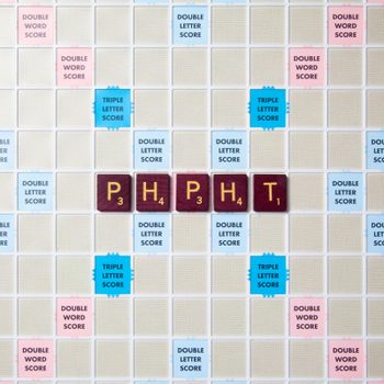 scrabble board with tiles that spell out phpht