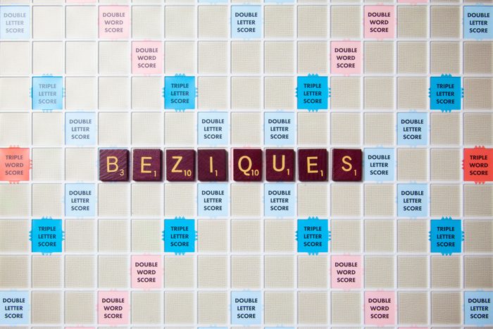 scrabble board with tiles that spell out beziques