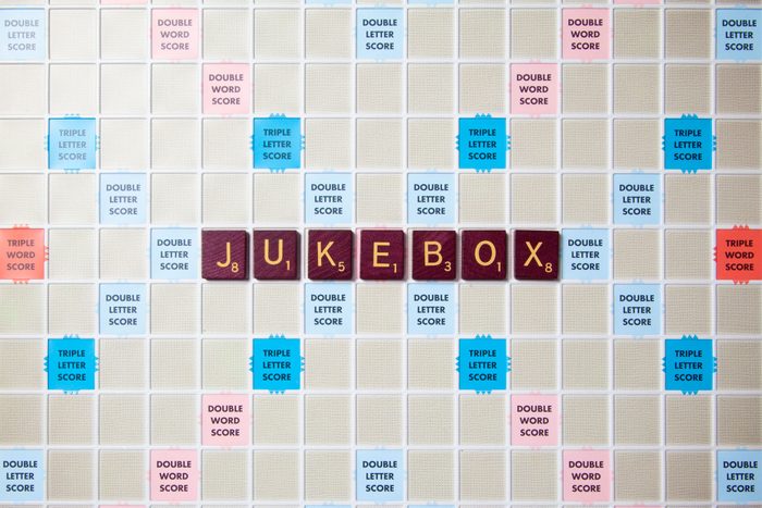 scrabble board with tiles that spell out jukebox