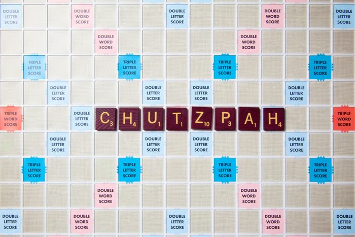 scrabble board with tiles that spell out chutzpah