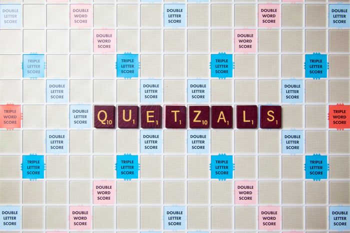 scrabble board with tiles that spell out quetzals