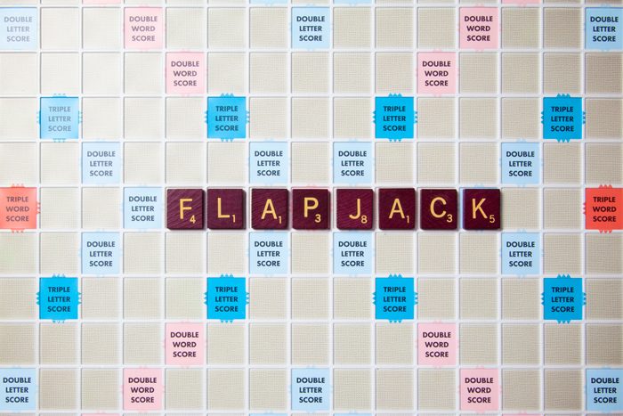 scrabble board with tiles that spell out flapjack