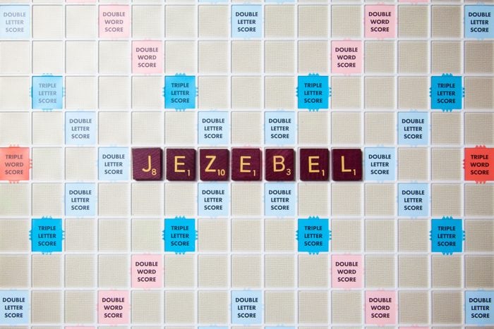 scrabble board with tiles that spell out jezebel