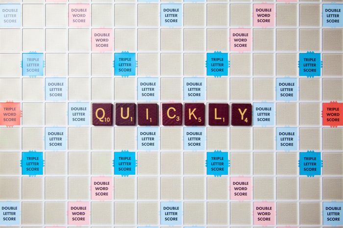 scrabble board with tiles that spell out quickly