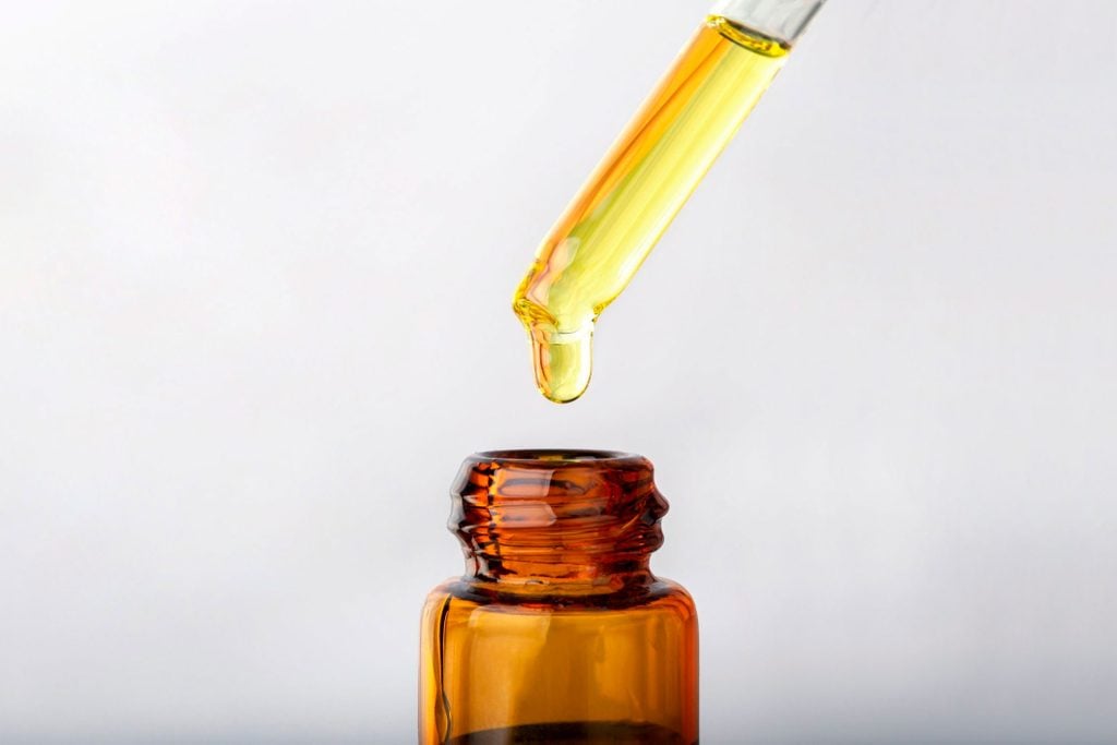 close up dropper with Cannabis CBD Oil used for medical purposes.marijuana CBD oil