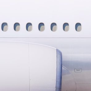 close up of engine and windows on airplane