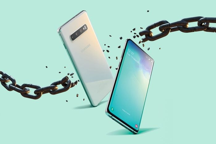 Two android phones breaking through a chain to represent rooting, or dismantling the phone's internal coding.