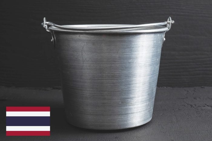 tin bucket of water with thailand flag