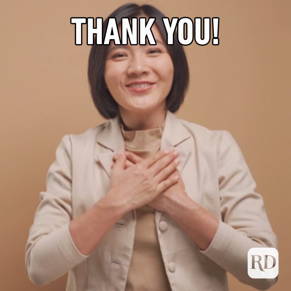 Woman saying "thank you" in sign language.