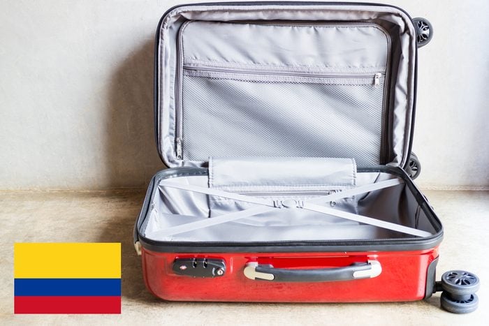 open suitcase with colombia flag