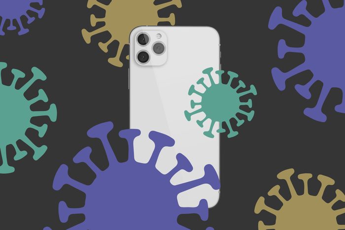 iPhone 12 surrounded by virus molecules on a dark background