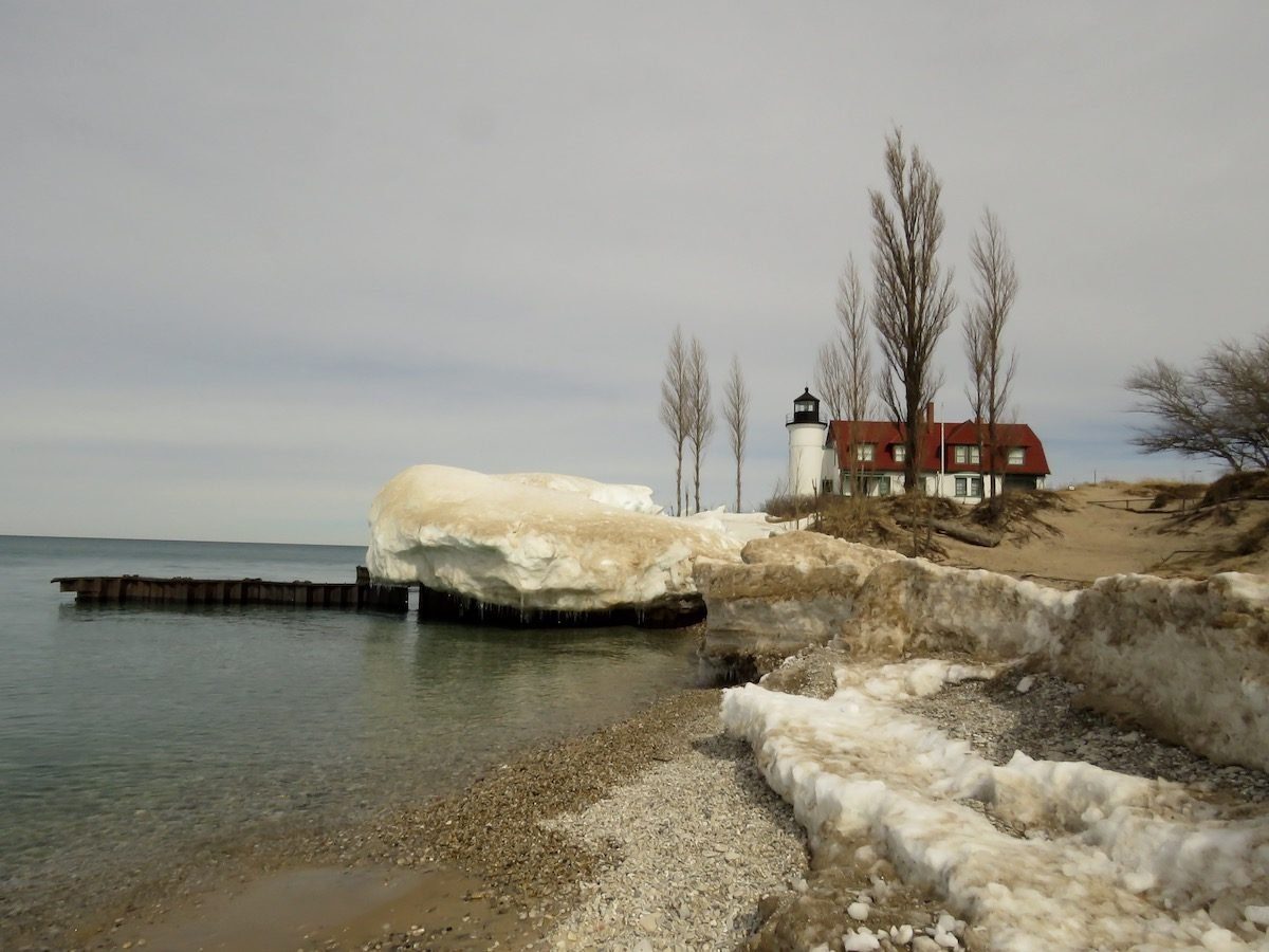 a winter scene at Point Betsie lighthouse in Frankfort on the shores of Lake Michigan