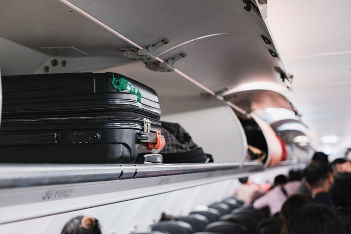 Overhead Locker On Airplane,passenger Put Cabin Bag Cabin On The Top Shelf