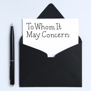 a pen and envelope with a paper sticking out that reads, "To Whom It May Concern:" in handwriting