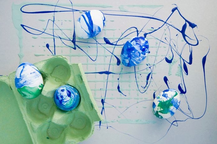 Easter eggs painted with blue and green nail varnish