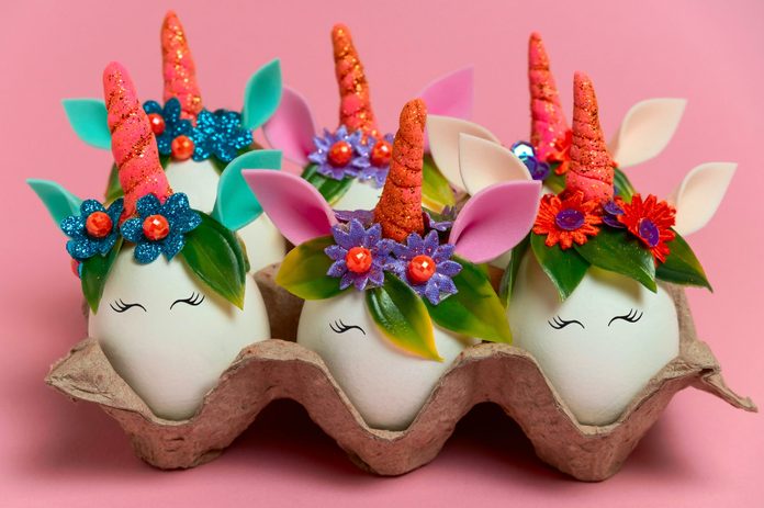 unusual Easter unicorn eggs on a pink background