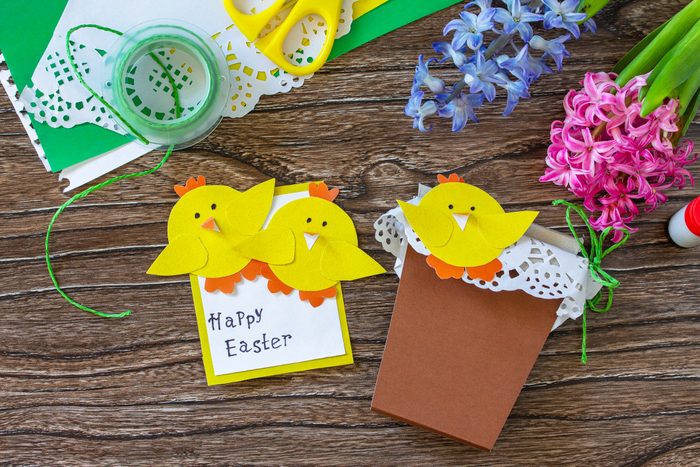 Child gift postcard happy easter chickens toy on a wooden table. Handmade. Project of childrens creativity, handicrafts, crafts for kids.