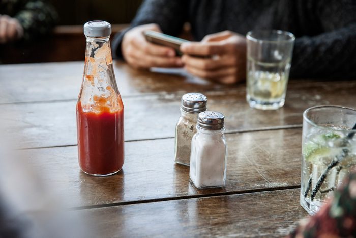 salt and pepper at the table on a bar/pub