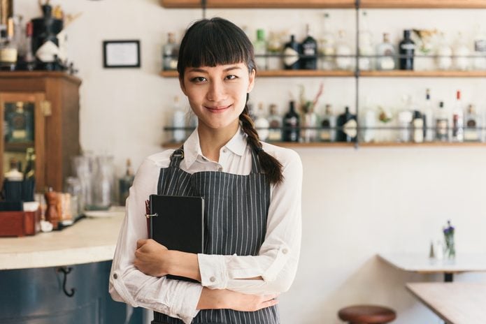 Portrait of female restaurant worker