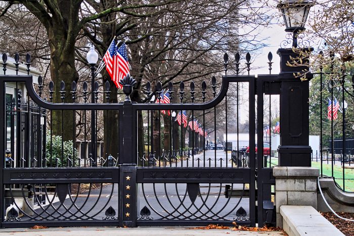 American Flags line drive inside gated White House grounds in Washington DC.