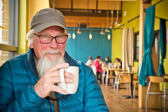Active senior enjoying coffee in cafe in Montana