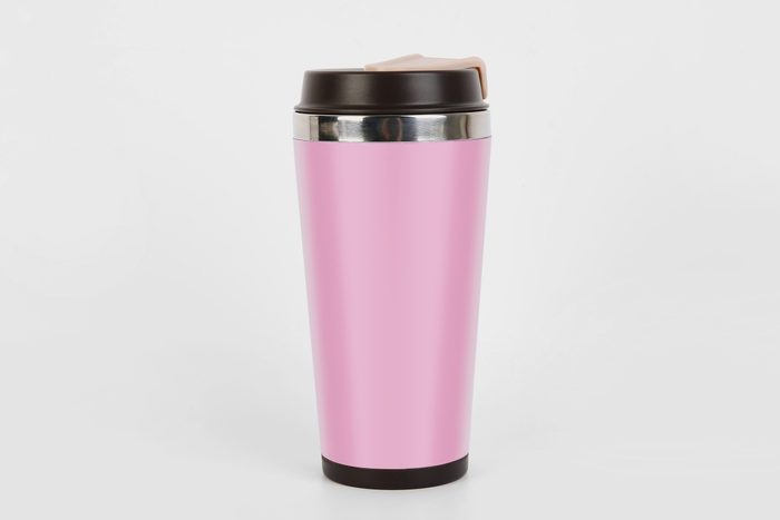 pink travel mug on a gray background