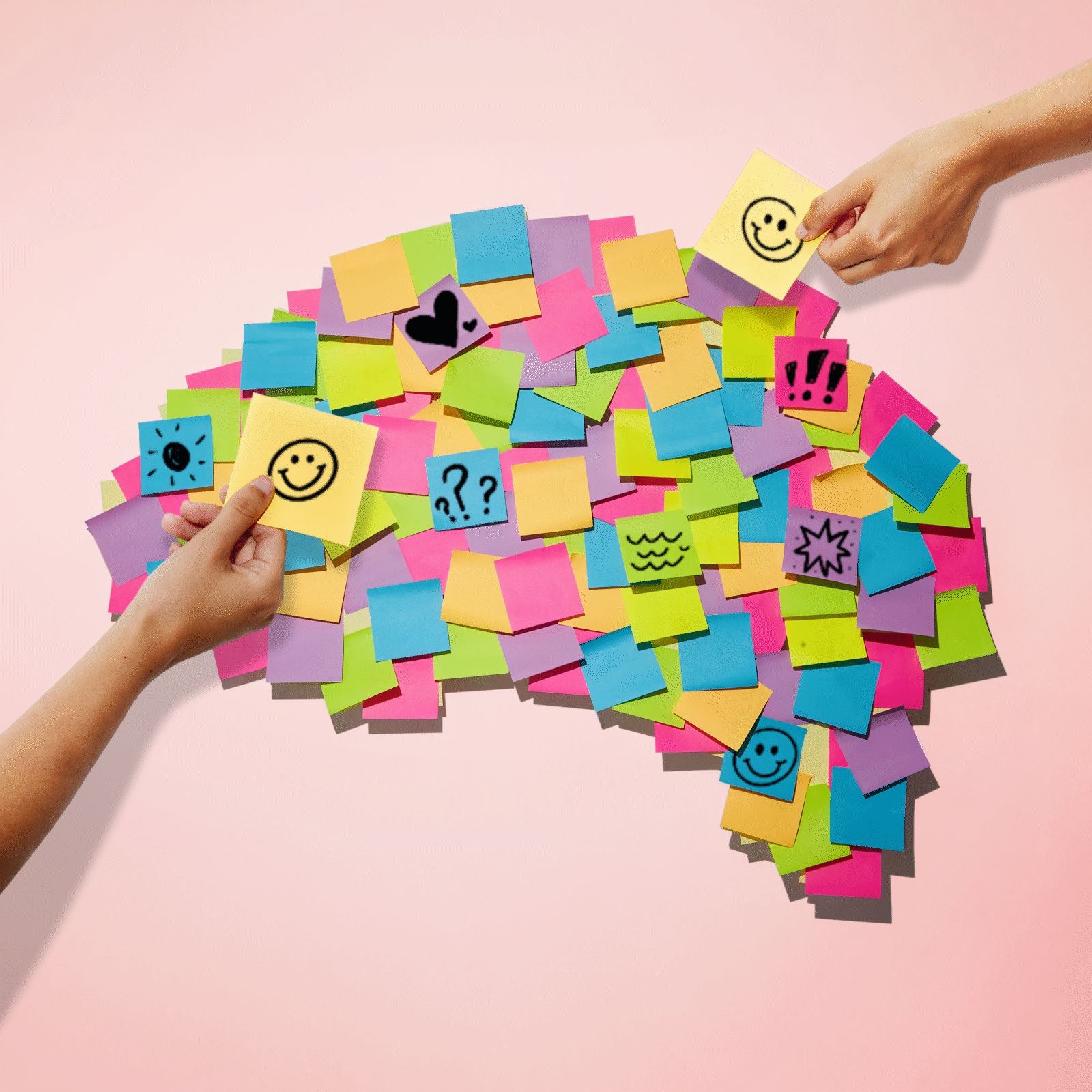 Post-it notes forming the shape of a brain with two hands animating in and out of screen, adding post-it notes to the collection.
