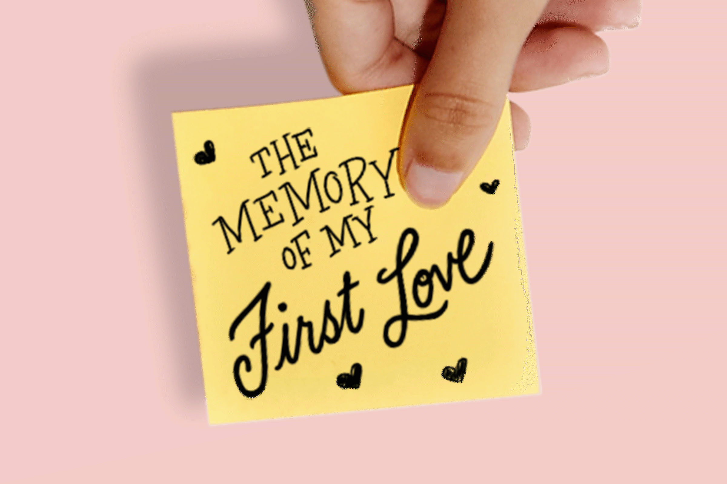 A post-it note with hand-lettering that says "the memory of my first love"