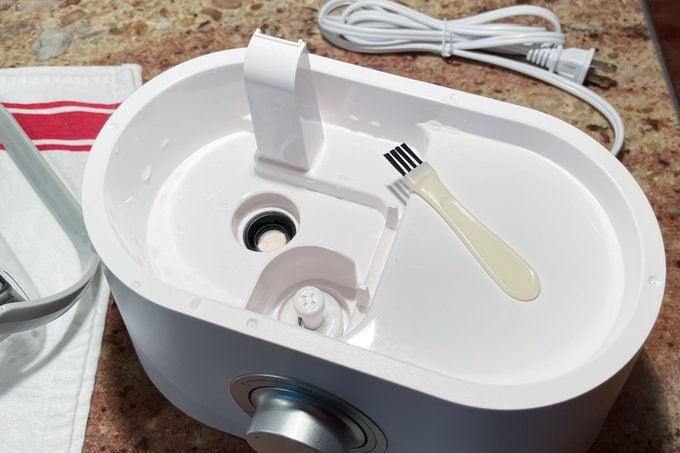 humidifier interior with small brush on kitchen counter