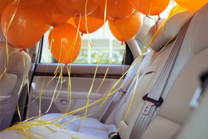 Orange balloons in back seat of car