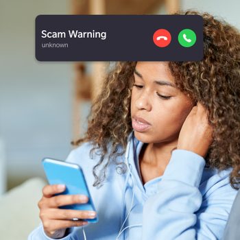 apprehensive woman looking at her phone with incoming scam call interface overlay