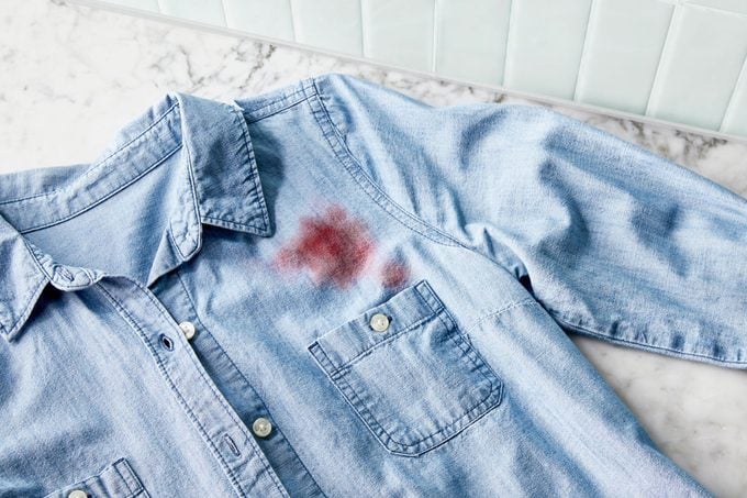 red wine stain on a denim shirt