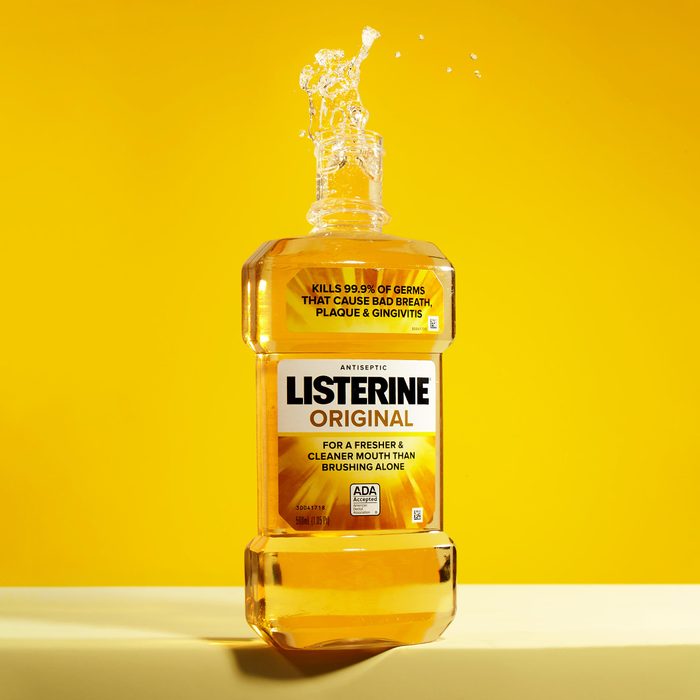 bottle of yellow listerine on yellow background