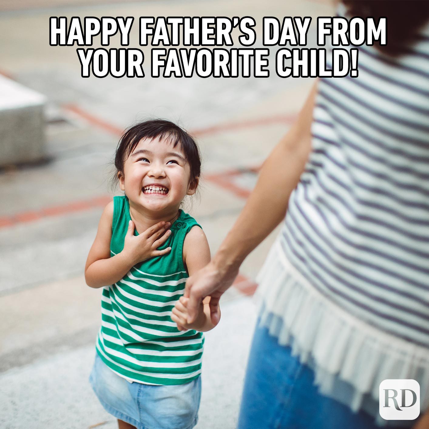 Child holding hands with mother and laughing. Meme text: Happy Father’s Day from your favorite child!