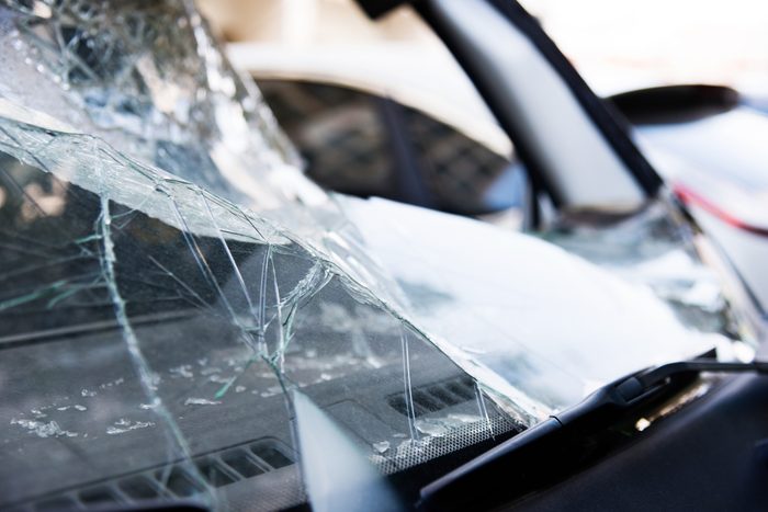 Broken windshield on a black car