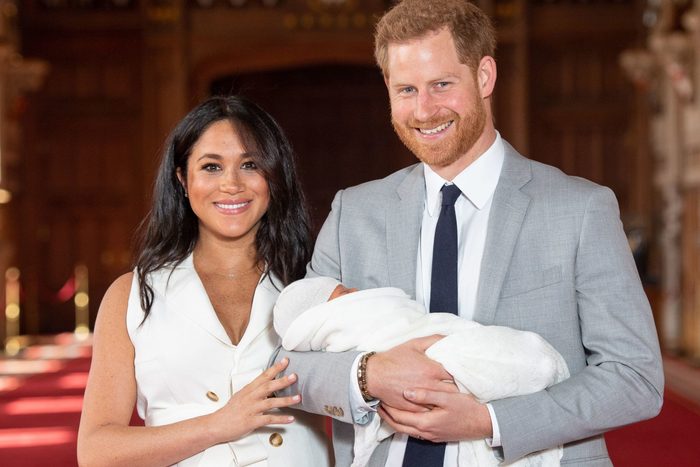 Prince Harry and Meghan pose for a photo with their newborn baby son, Archie, in St George's Hall at Windsor Castle in Windsor, west of London on May 8, 2019.