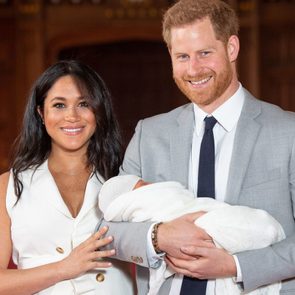 Prince Harry and Meghan pose for a photo with their newborn baby son, Archie, in St George's Hall at Windsor Castle in Windsor, west of London on May 8, 2019.